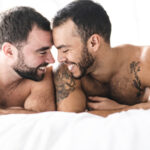 A Handsome gay men couple on bed together